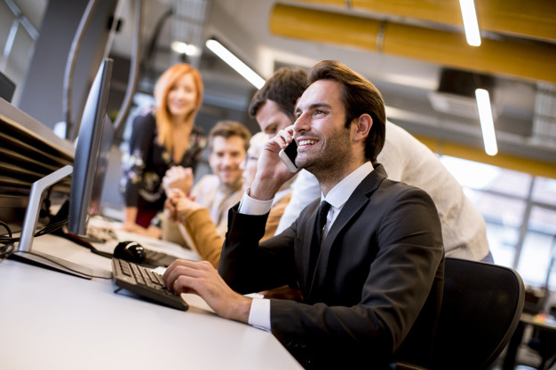 Group of young business people are working together with laptop